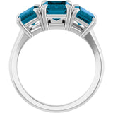 Platinum 8x6 mm Emerald Natural London Blue Topaz Three-Stone Ring