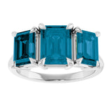 Platinum 8x6 mm Emerald Natural London Blue Topaz Three-Stone Ring